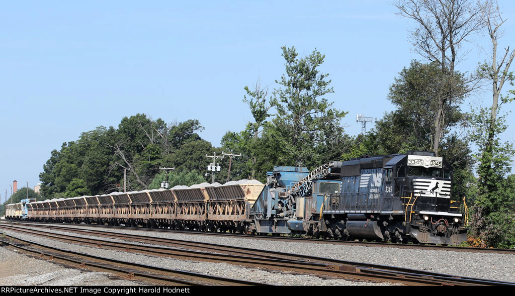 NS 3345 leads loaded ballast train 90J towards the "H" line